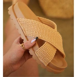 Awaken Natural Flyknit Criss Cross Slide Sandals.